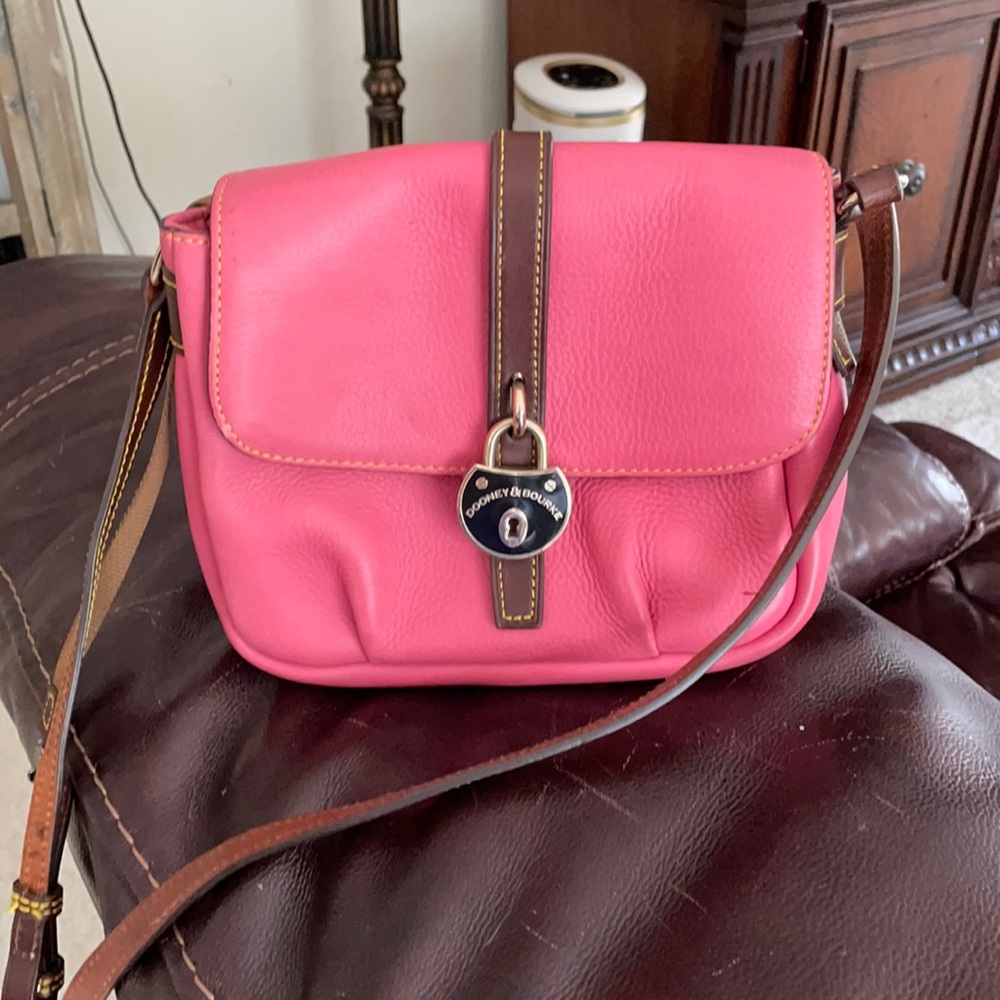 Pink and tan Dooney and Bourke crossbody bag.